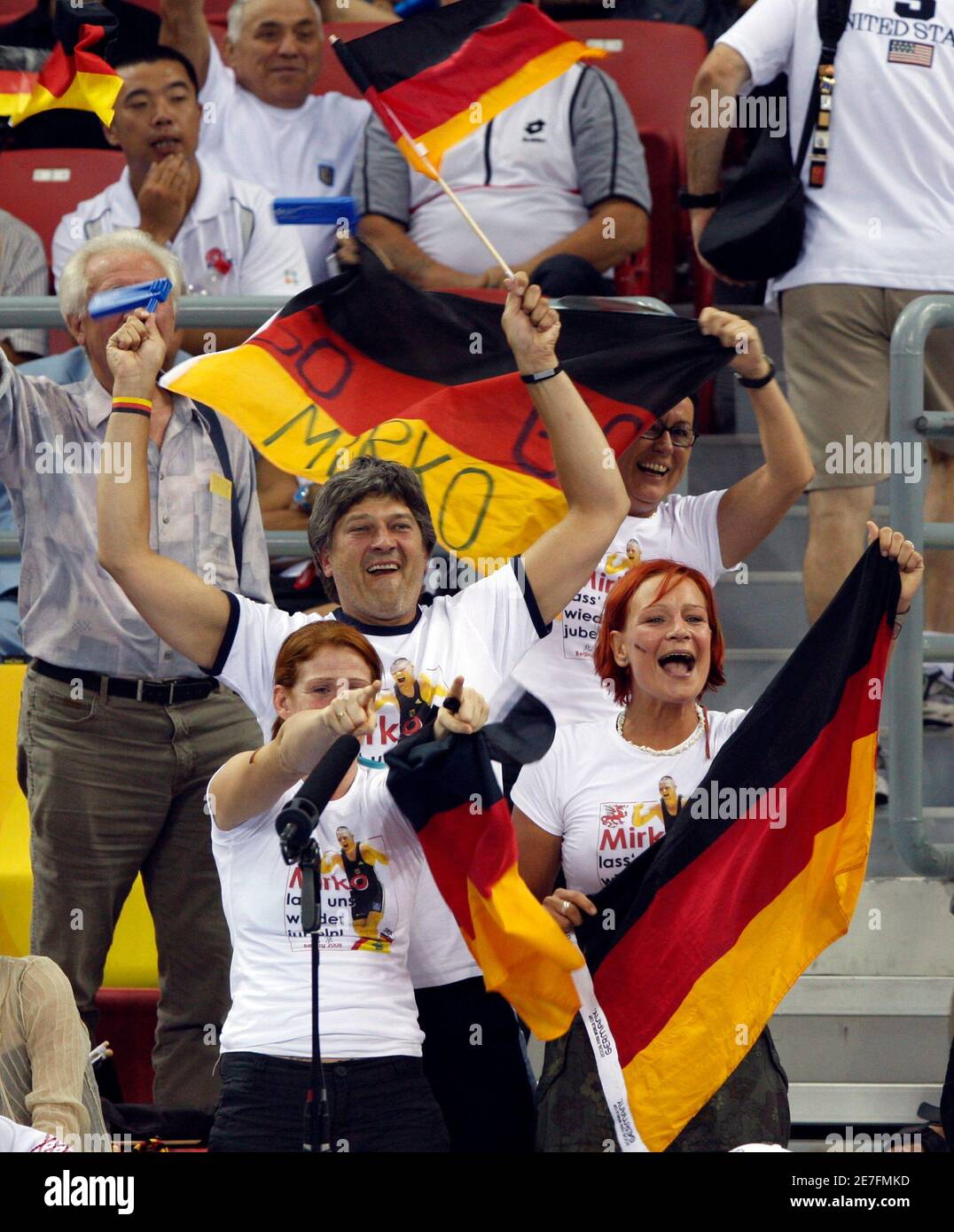 Supporters of Mirko Englich of Germany cheer for him during his 96kg men's Greco-Roman wrestling semi-final matchagainst Adam Wheeler of the U.S. at the Beijing 2008 Olympic Games August 14, 2008.     REUTERS/Oleg Popov (CHINA) Stock Photo