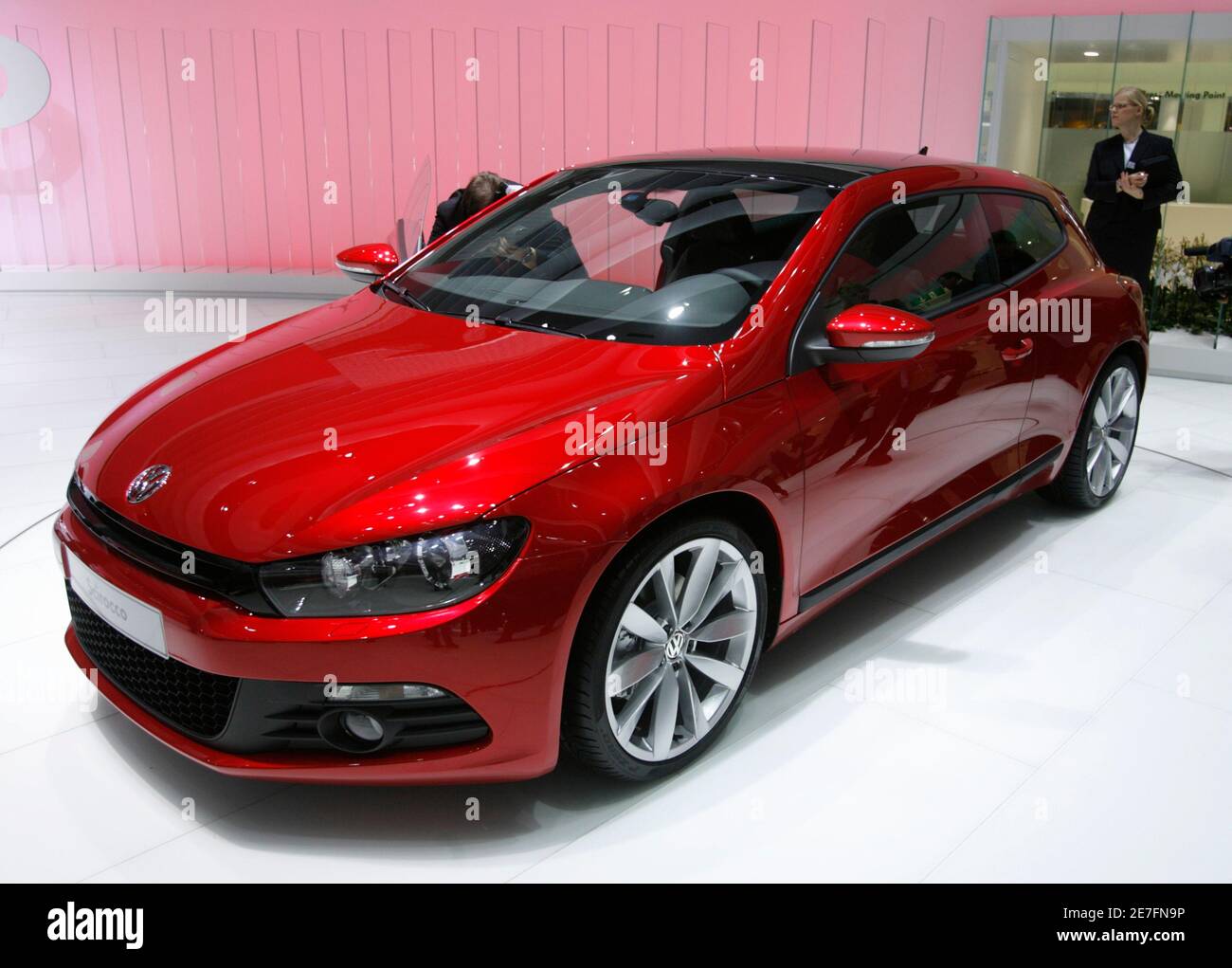 A Volkswagen Scirocco is displayed during the first media day of the 78th  Geneva Car Show at the Palexpo in Geneva March 4, 2008. REUTERS/Denis  Balibouse (SWITZERLAND Stock Photo - Alamy