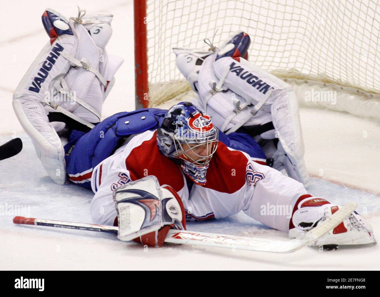 Montreal Canadiens' goaltender Carey Price dives to cover the puck against the Ottawa Senators during the second period of their NHL hockey game in Ottawa April 1, 2008.       REUTERS/Chris Wattie       (CANADA) Stock Photo