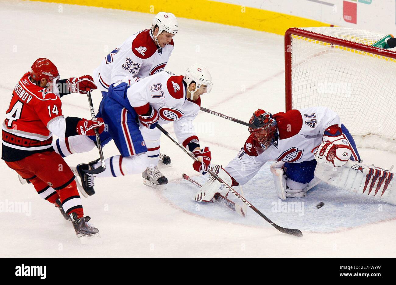 Montreal Canadiens players (L-R) Travis Moen, Max Pacioretty and goaltender  Jaroslav Halak stop the Carolina Hurricanes' Sergei Samsonov short of the  goal during the third period of their NHL hockey game in