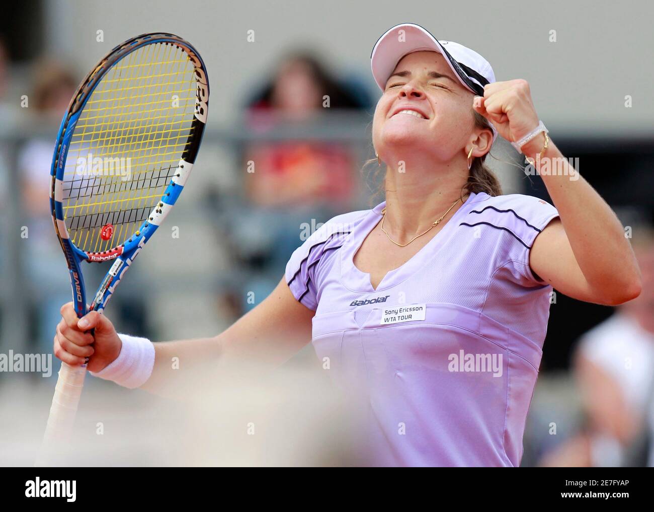 Romania's Alexandra Dulgheru celebrates winning against China's Zheng Jie  during the final match of the Warsaw Open tennis tournament May 22, 2010.  REUTERS/Peter Andrews (POLAND - Tags: SPORT TENNIS Stock Photo - Alamy