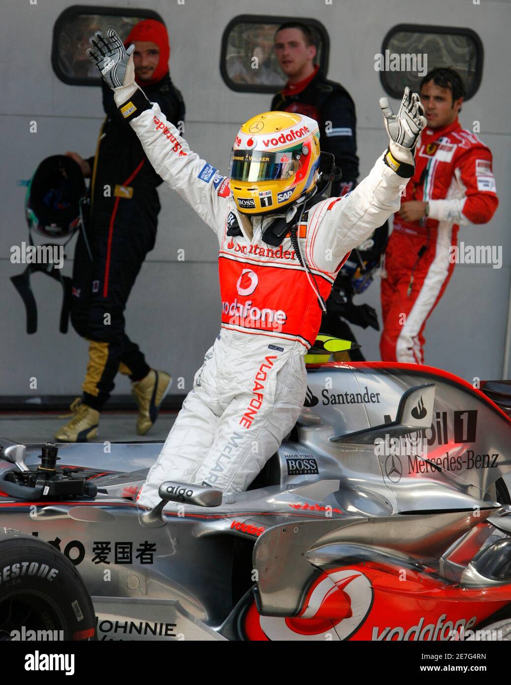 Mclaren S Formula One Driver Lewis Hamilton Of Britain Celebrates After Finishing Second In The Malaysian F1 Grand Prix In Sepang April 8 2007 The Other F1 Drivers Walking Behind Hamilton Includes Ferrari S