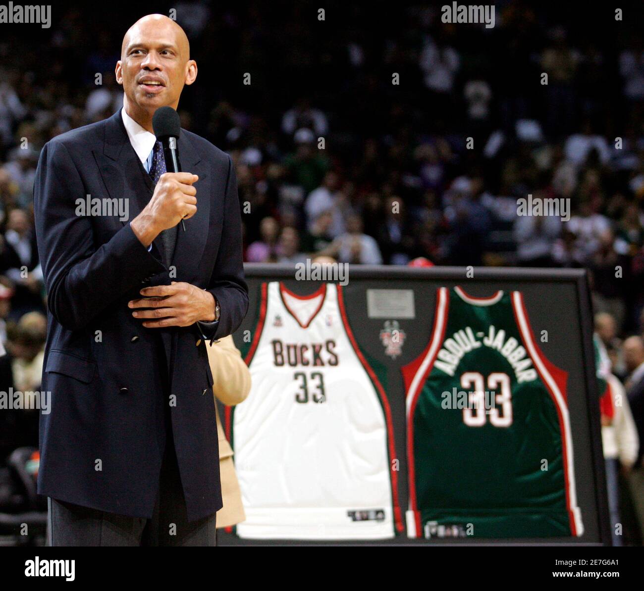 Fromer Milwaukee Bucks center Kareem Abdul-Jabbar speaks to fans after his jersey  number 33 was retired by the Bucks at halftime of an NBA basketball game  between the Bucks and Los Angeles