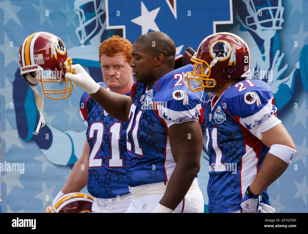 NFC Washington Redskins players (L-R) Ethan Albright, Chris Cooley and  Chris Samuels wear the #21 jersey in memory of slain Redskins player Sean  Taylor during the NFL Pro Bowl at Aloha Stadium