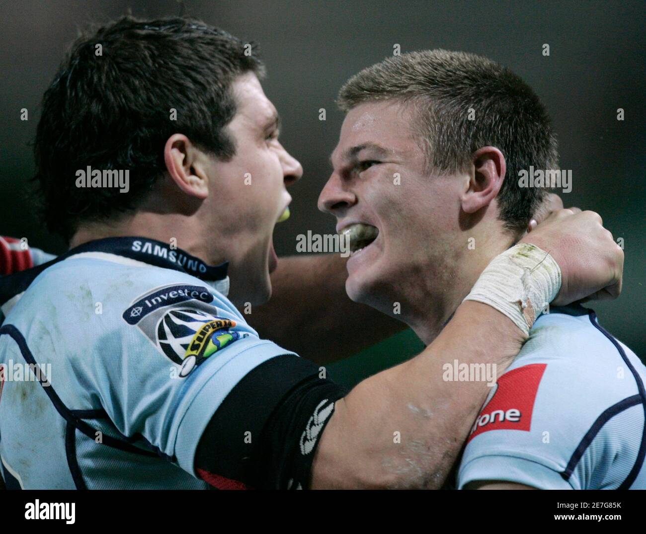 Rob Horne of the Waratahs from Australia (R) is joined by tea mate Tom Carter after scoring against the Sharks from South Africa during their Super 14 semi-final rugby match in Sydney May 24, 2008. REUTERS/Will Burgess    (AUSTRALIA) Stock Photo