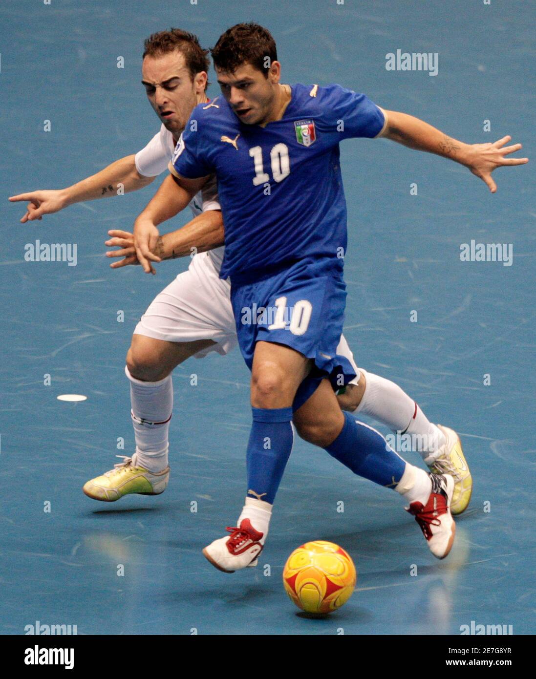 Adriano Foglia (R) of Italy controls the ball in front Ricardinho of  Portugal during their FIFA Futsal World Cup qualifying soccer match at the  Gimnasio Maracanazinho in Rio de Janeiro October 4,