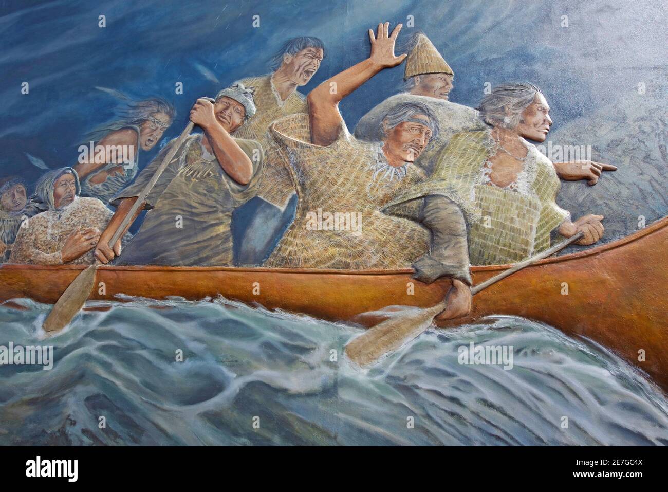 Wall art on a building in Chemainus depictiong fist nation pioneering settlers arriving in their new lands on Vancouver Island. Stock Photo