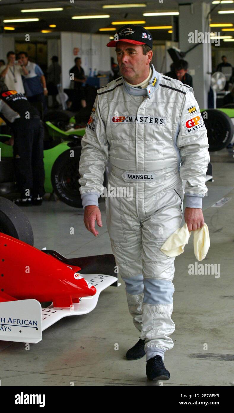 Britain's Nigel Mansell walks in the pit during their F-1 motor race free practice session in Kyalami north of Johannesburg November 11, 2005. The Grand Prix race will be held on Sunday. REUTERS Juda Ngwenya Stock Photo