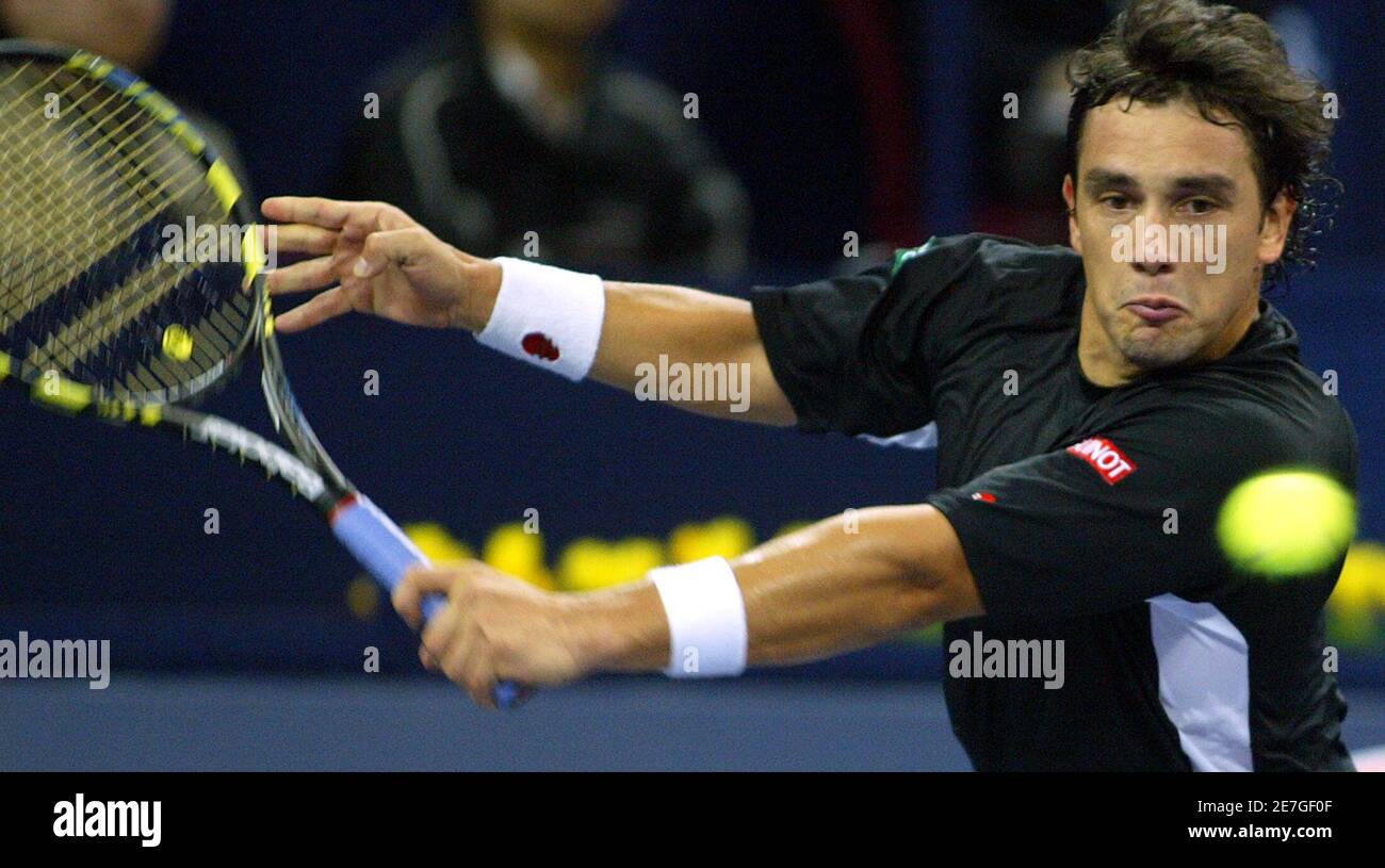 Mariano Puerta returns a shot to Gaston Gaudio during the Tennis Masters Cup  in Shanghai, China November 14, 2005. Gaudio defeated Puerta 6-3 7-5.  REUTERS/Aly Song Stock Photo - Alamy
