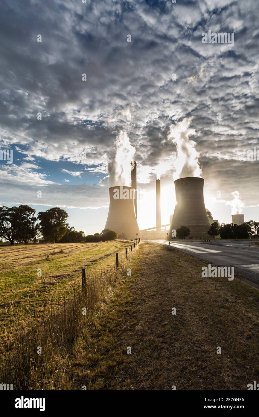 Smokestacks and cooling towers of coal fired power plants. Stock Photo