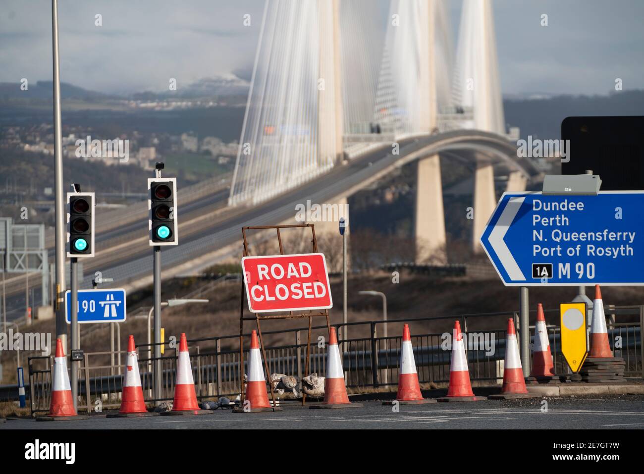 South Queensferry, Scotland, UK. 30 January 2021.  Queensferry Crossing bridge closed and Forth Road Bridge opened to all traffic this morning as temporary traffic diversion experiment is carried out. Highway operators are investigating the feasibility of diverting traffic from M90 from Queensferry Crossing onto the Forth Road Bridge at times when the Queensferry Crossing has to close because of ice on the cables for example. Extensive traffic management works are required however because no direct traffic access points were constructed between carriageways on each bridge. Pic; M90 motorway is Stock Photo