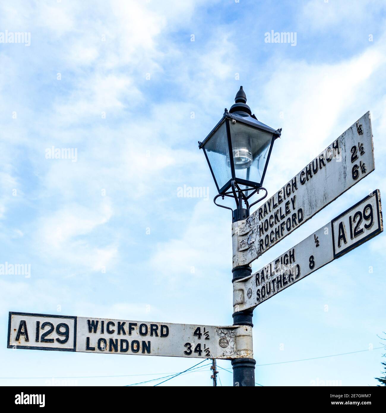 Old, well established road signs in Essex Stock Photo Alamy
