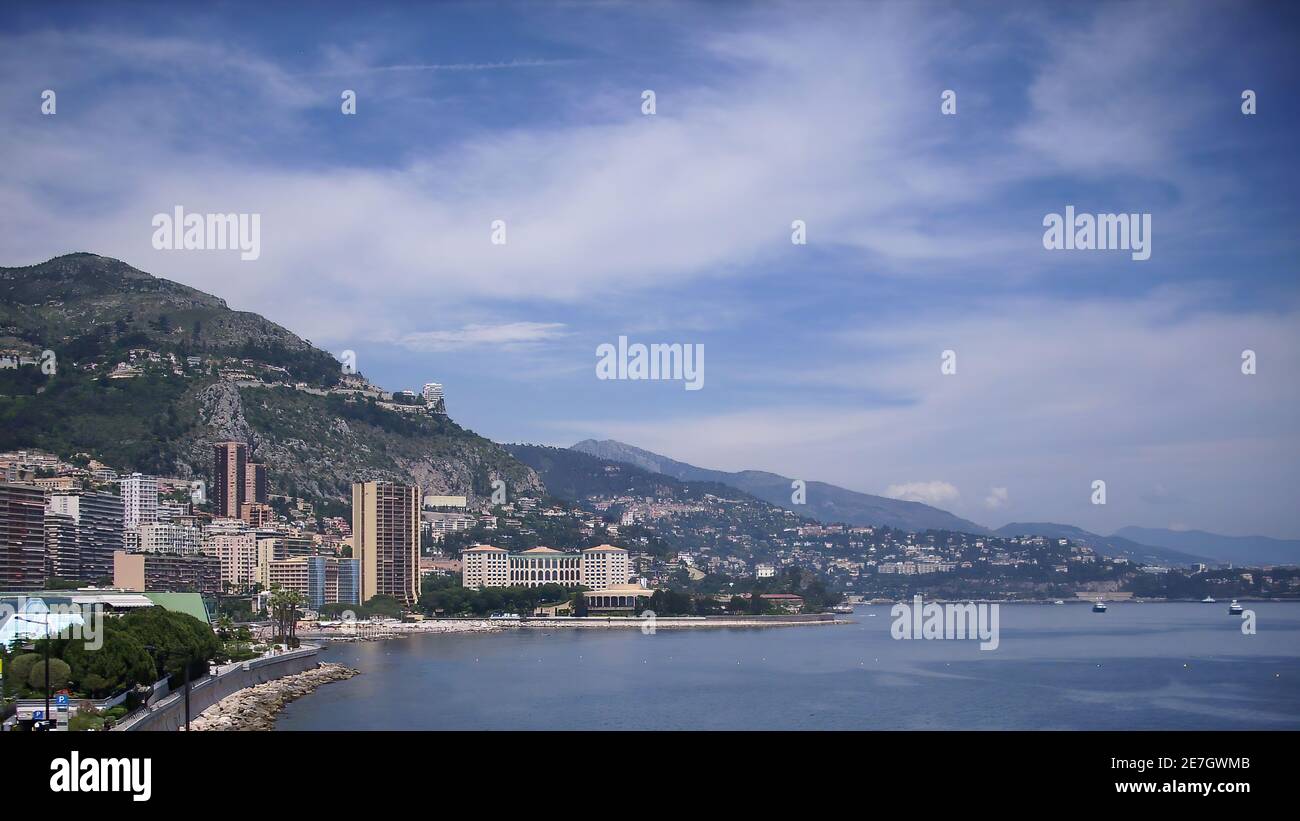 Monaco, Monte Carlo - 15th May 2018: A german photographer visiting the French Riviera, having a one-day trip to Monaco, taking pics of the shoreline. Stock Photo