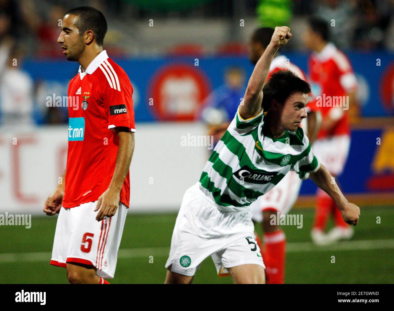 Celtic's Paul McGowan celebrates scoring in front of Benfica's Ruben Amorim  (L) during the first half of their friendly soccer match in Toronto,  September 2, 2009. REUTERS/Mark Blinch (CANADA SPORT SOCCER Stock