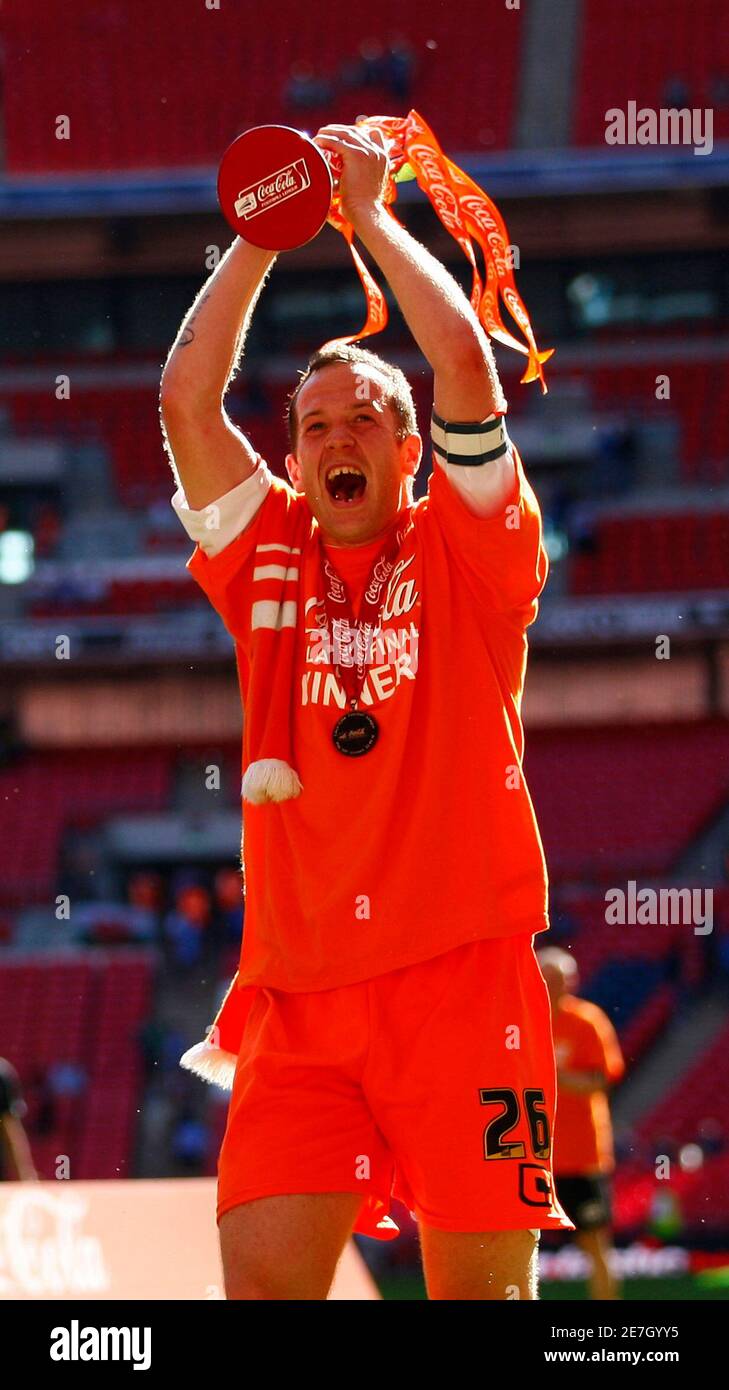 Blackpool's Charlie Adam celebrates with the trophy after their English Championship play-off final soccer match victory over Cardiff City at Wembley Stadium in London May 22, 2010. REUTERS/Eddie Keogh  (BRITAIN-Tags: - Tags: SPORT SOCCER) Stock Photo