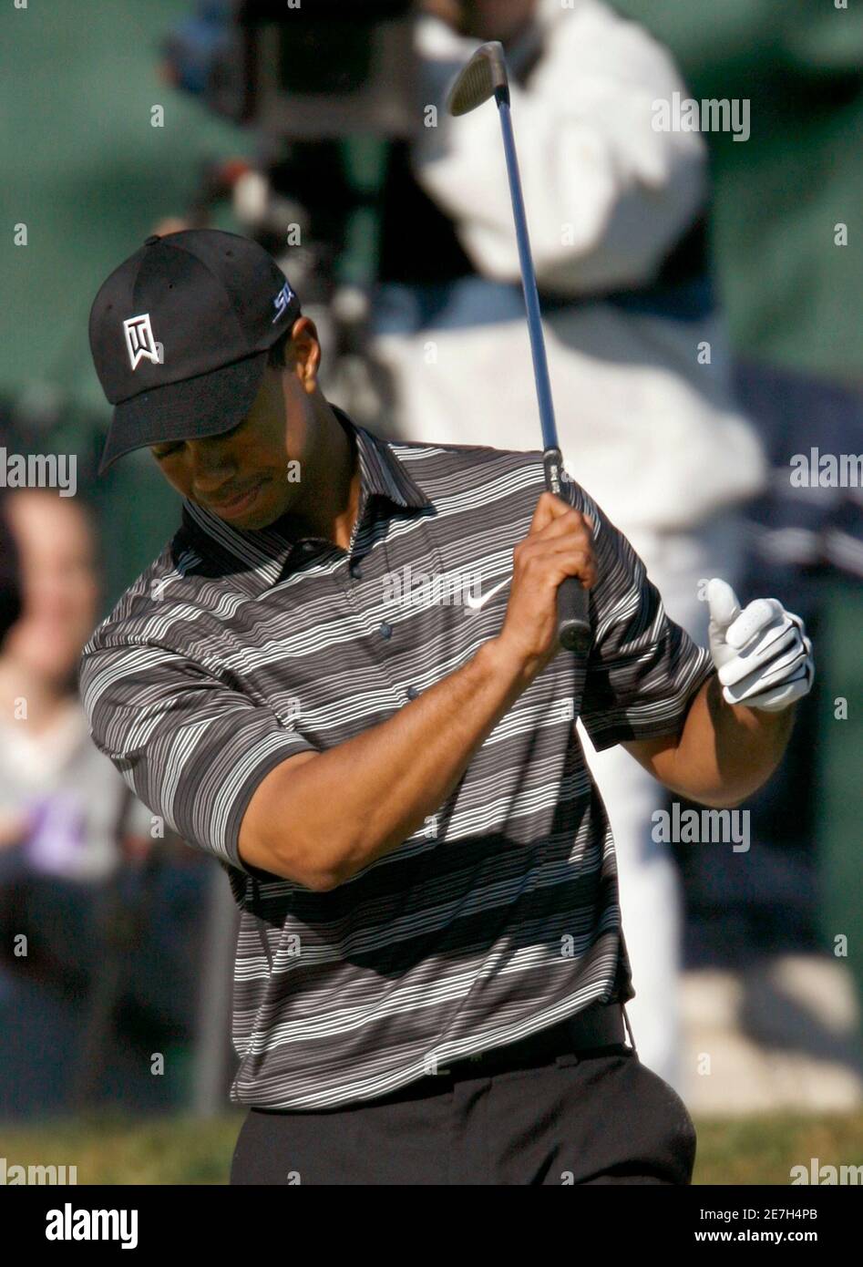 Tiger Woods of the U.S. reacts to a bunker shot on the 18th green during second round play on the south course at the Buick Invitational golf tournament at Torrey Pines in La Jolla, California January 26, 2007.  REUTERS/Mike Blake (UNITED STATES) Stock Photo