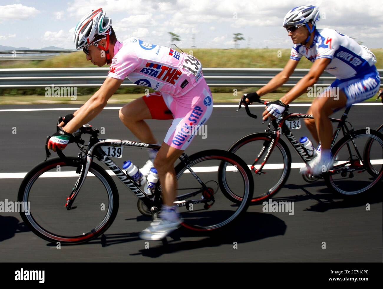 Italy's Giovanni Visconti (L), wearing the leader's pink jersey, cycles ahead of compatriot Mauro Facci during the ninth stage of the Giro d'Italia cycling race 218-km from Civitavecchia to San Vincenzo May 18, 2008.  REUTERS/Giampiero Sposito (ITALY) Stock Photo