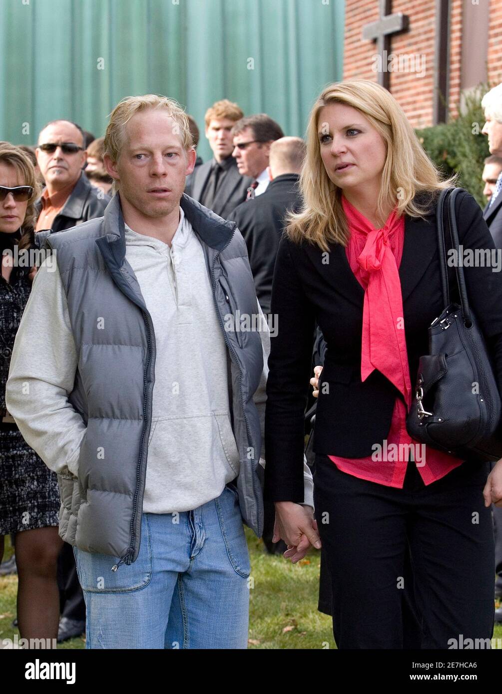Toronto Maple Leafs forward Jason Blake and his wife Sara leave the church  after funeral services for their former neighbour Evan Frustaglio in  Toronto November 2, 2009. Thirteen-year-old Evan Frustaglio passed away