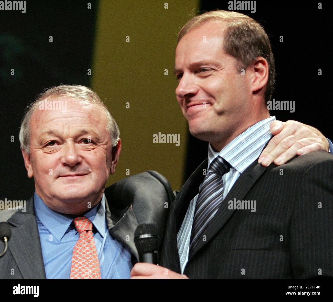 Outgoing Tour de France cycling race director Jean-Marie Leblanc (L)  introduces his successor Christian Prudhomme (R) during the presentation of  the itinerary of the 2006 race in Paris, October 27, 2005. The