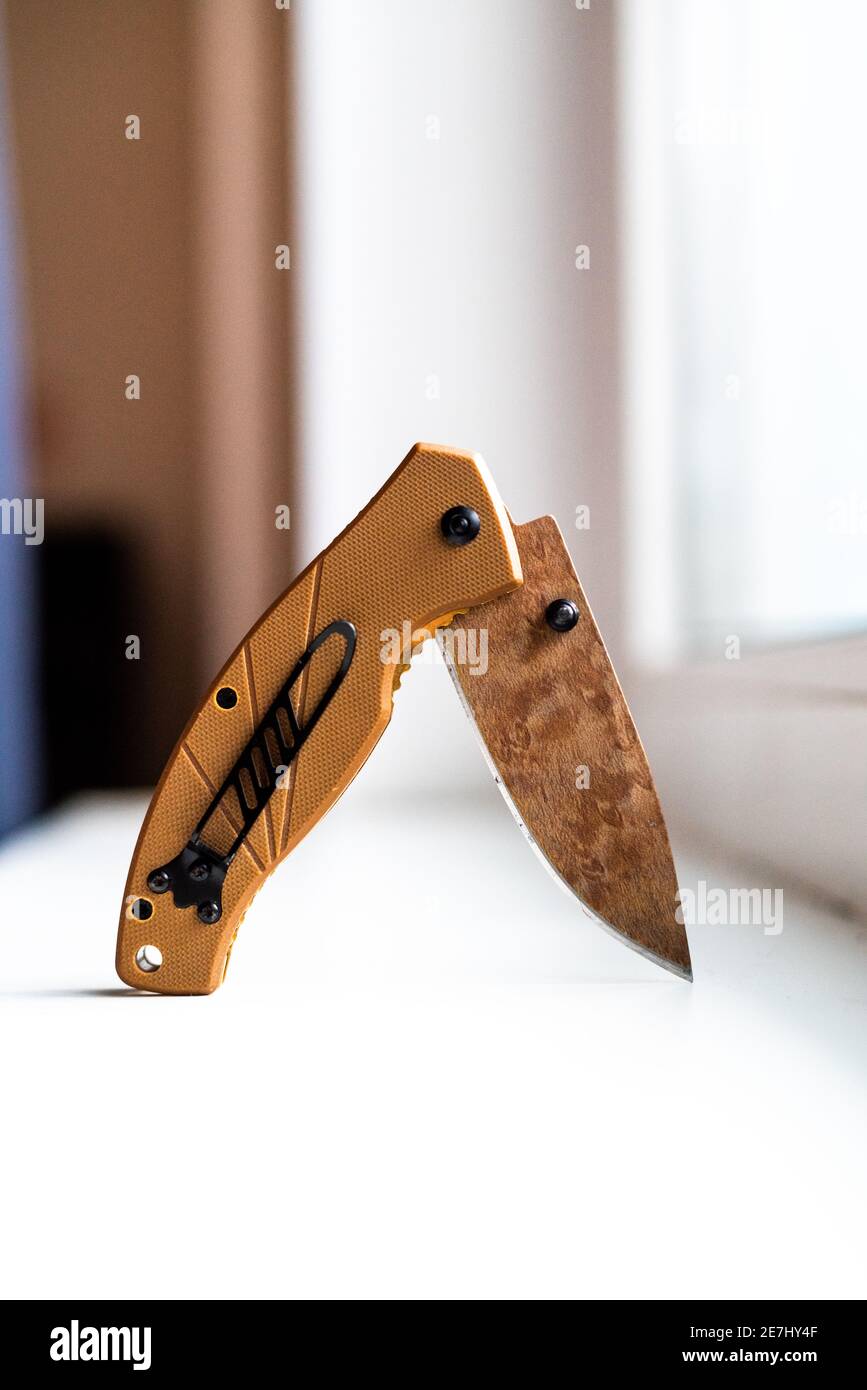 folding hunting knife on a white background Stock Photo