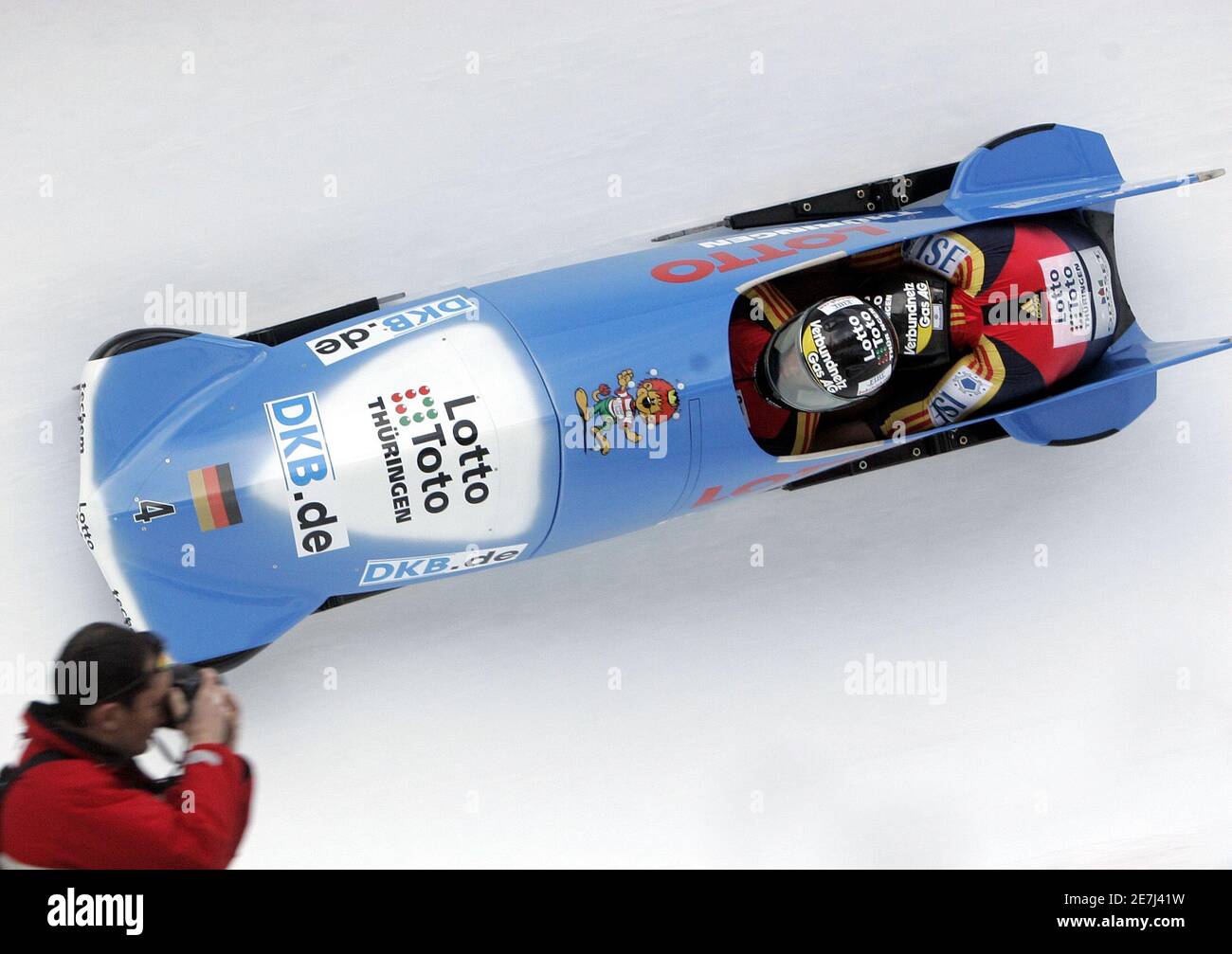 Germany three with pilot Andre Lange (L) and brakeman Kevin Kuske (R) speeds down in their bobsleigh during their first run at the FIBT Bobsleigh World Cup competition at the Olympia Bob Run in St Moritz, Switzerland, January 21, 2006. Germany three won the competition ahead of Switzerland two and third placed Switzerland three. REUTERS/Andreas MeierREUTERS/Andreas Meier Stock Photo