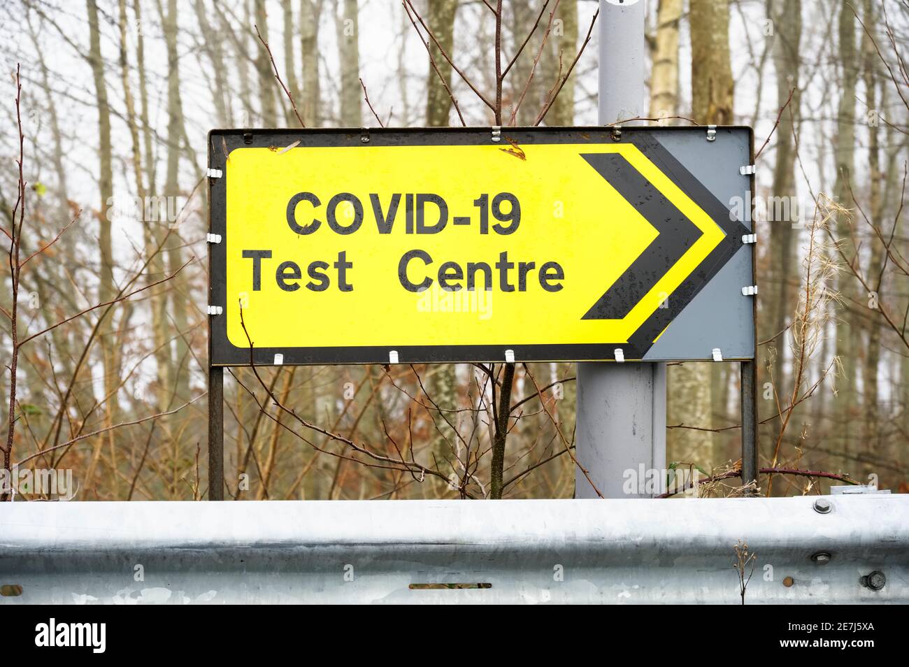 Covid-19 test centre sign at road with traffic cones Stock Photo