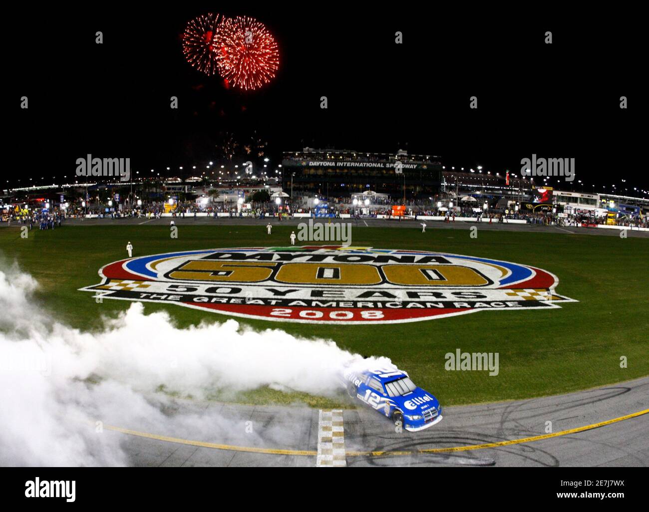 Ryan Newman celebrates by spinning the tires of his number 12 Dodge
