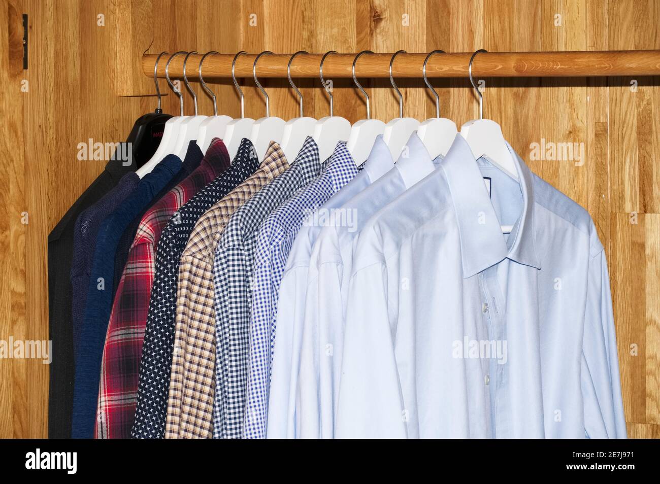 Clothing hanging on rail in hires stock photography and images Alamy