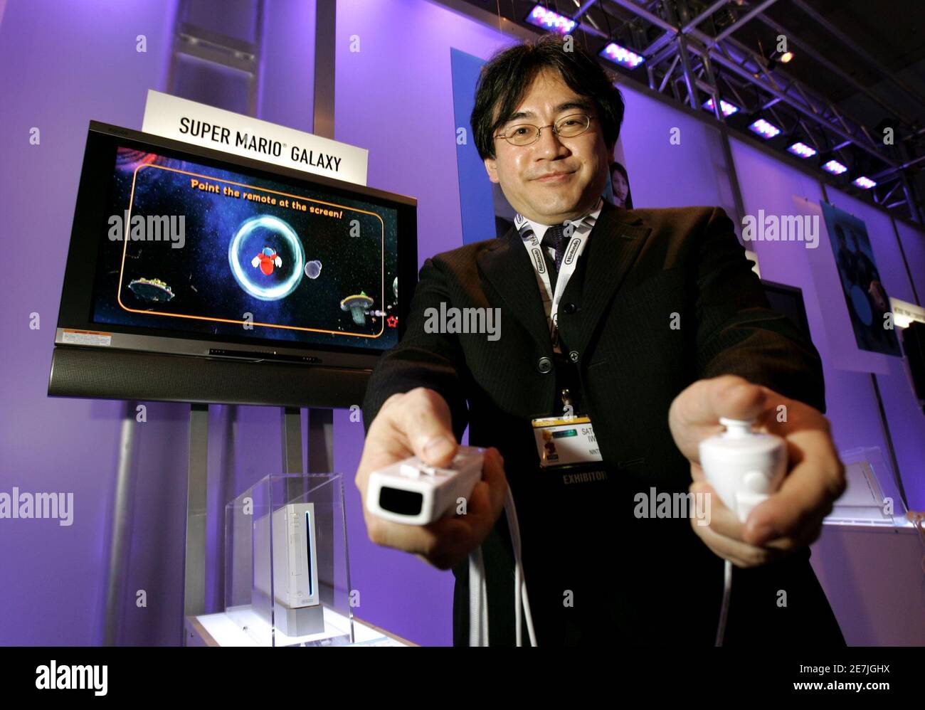 Nintendo President Satoru Iwata shows off the Nintendo "Wii" and its  wireless game controllers at the 2006 Electronic Entertainment Expo in Los  Angeles May 10, 2006. The "Wii" controller permits users to
