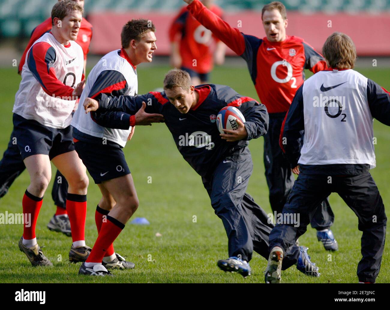 England's Jonny Wilkinson runs with the ball during rugby practice at Twickenham Stadium in London January 23, 2007. Wilkson is named in the England rugby squad to face Scotland in the opening match of their Six Nations campaign which is due to start next week.   REUTERS/Dylan Martinez    (BRITAIN) Stock Photo