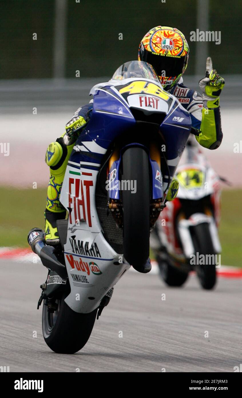Yamaha MotoGP 2008 World Champion Valentino Rossi of Italy reacts during  the qualifying session at the Sepang International Circuit near Kuala  Lumpur October 18, 2008. The Malaysian Grand Prix will be held