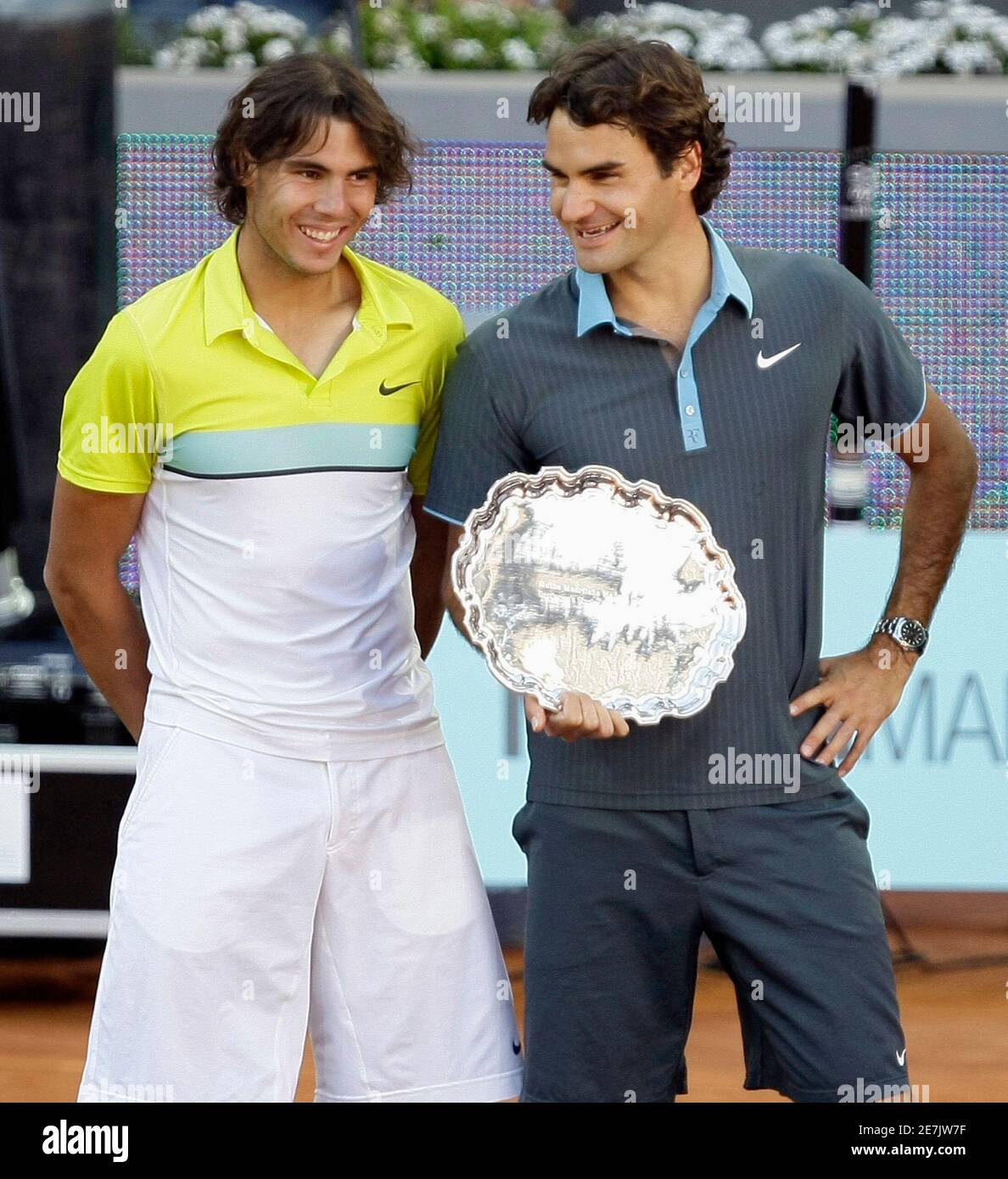 Switzerland's Roger Federer and Rafael Nadal of Spain talk during a trophy  ceremony at the end of their final match at the Madrid Open tennis  tournament May 17, 2009. REUTERS/Juan Medina (SPAIN
