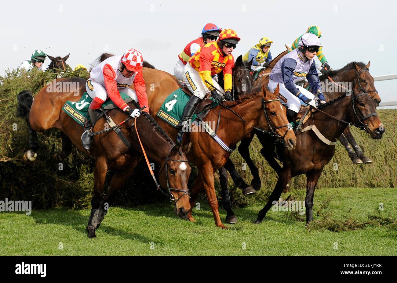 Launde ridden by jockey Ward-Thomas (L), Blu Teen ridden by jockey Mahon and Sonevafushi ridden by jockey Jake Greenall jumps the Chair in the Fox Hunters' Steeple Chase during the first day of The Grand National Meeting at Aintree Racecourse, Liverpool, northern England April 8, 2010.    REUTERS/Russell Cheyne (BRITAIN - Tags: SPORT HORSE RACING) Stock Photo