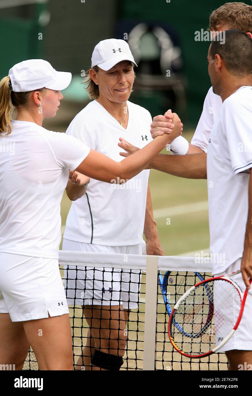 Martina Navratilova of the U.S. (2nd L) shakes hands with Israel's Andy Ram (R) after losing her mixed doubles match, with Mark Knowles of the Bahamas, and Russia's Vera Zvonareva (L) at the Wimbledon tennis championships in London July 6, 2006. This year was the last year Navratilova will play at Wimbeldon. REUTERS/Alessia Pierdomenico       (BRITAIN) Stock Photo