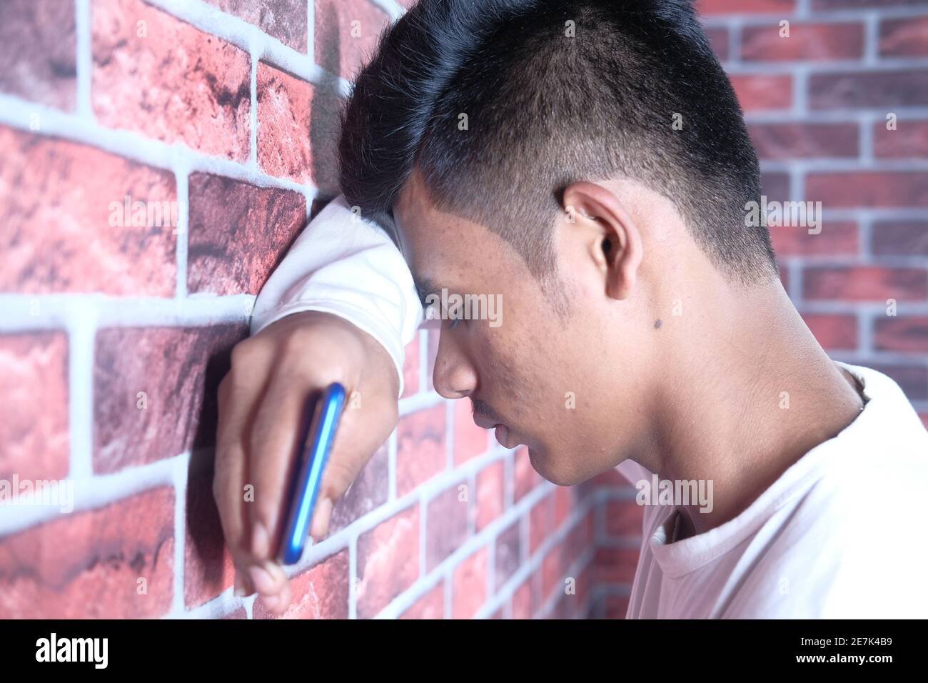 Close up of sad man covering face with hand Stock Photo - Alamy