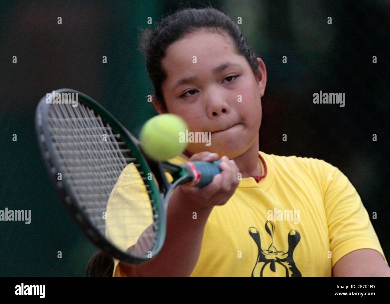 Ariya Jutanukarn, 11, shows off her tennis forehand in Bangkok, October 30,  2007. When Jutanukarn teed off at the recent Honda LPGA Thailand, she  became the youngest golfer to compete in a