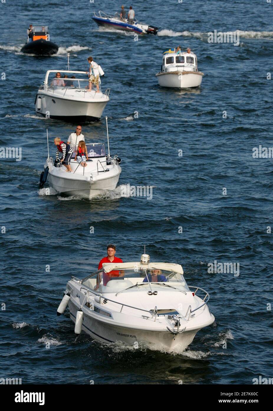 Motor boats wait to pass through a lock system in Stockholm's busy inner  harbor in this photo taken August 8, 2007. You need a licence to drive a  car or fly a