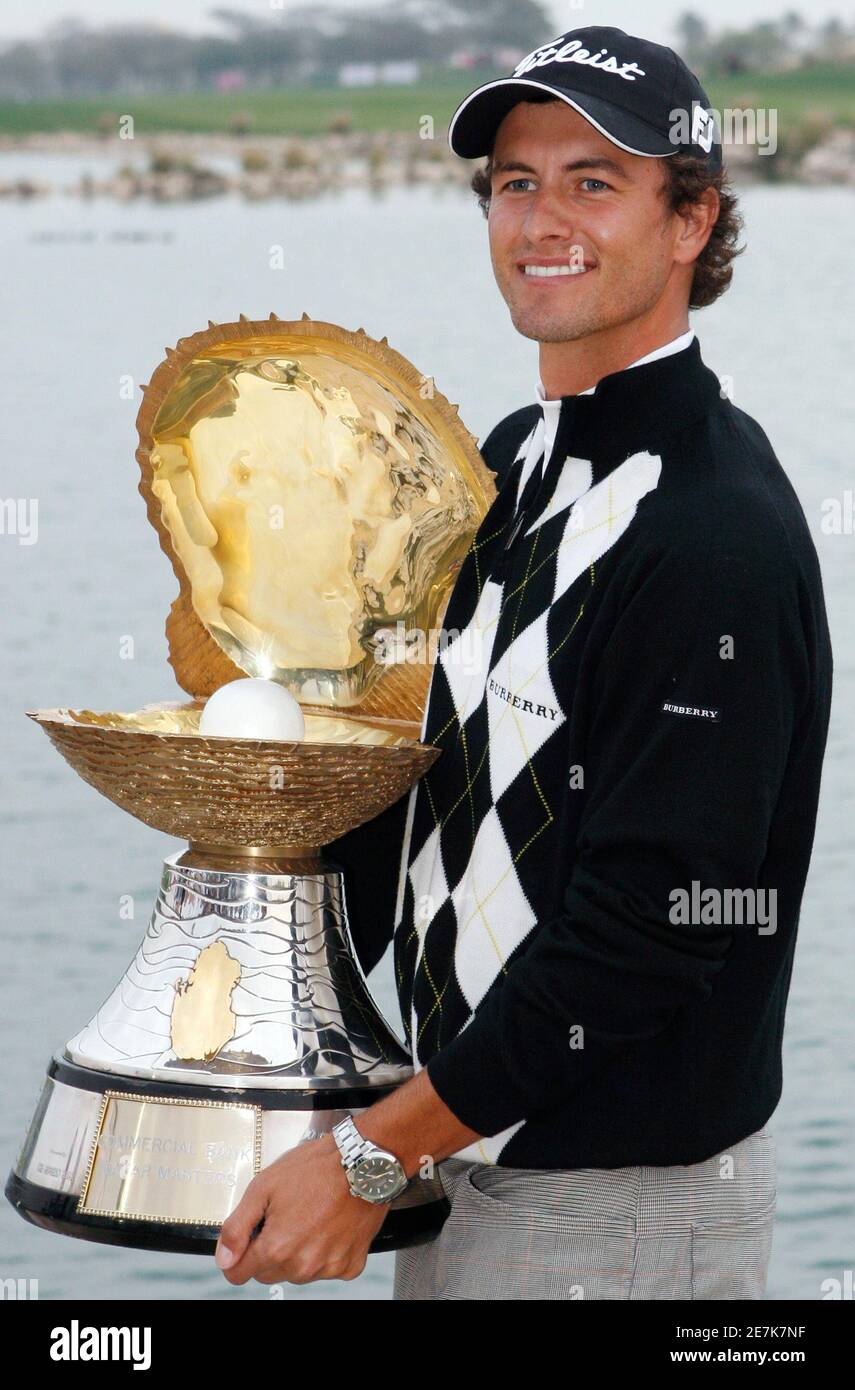 Adam Scott of Australia poses with the trophy after he won the Qatar  Masters golf tournament in Doha January 27, 2008. REUTERS/Fadi Al-Assaad  (QATAR Stock Photo - Alamy