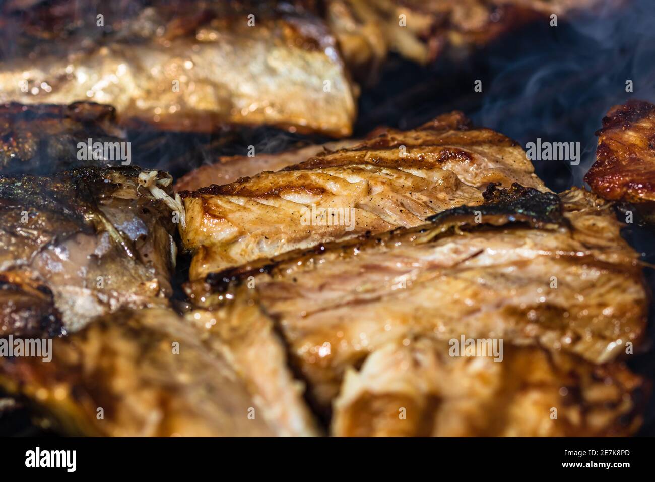 Grilled mackerel fish with smoke on a charcoal barbecue grill Stock Photo Alamy