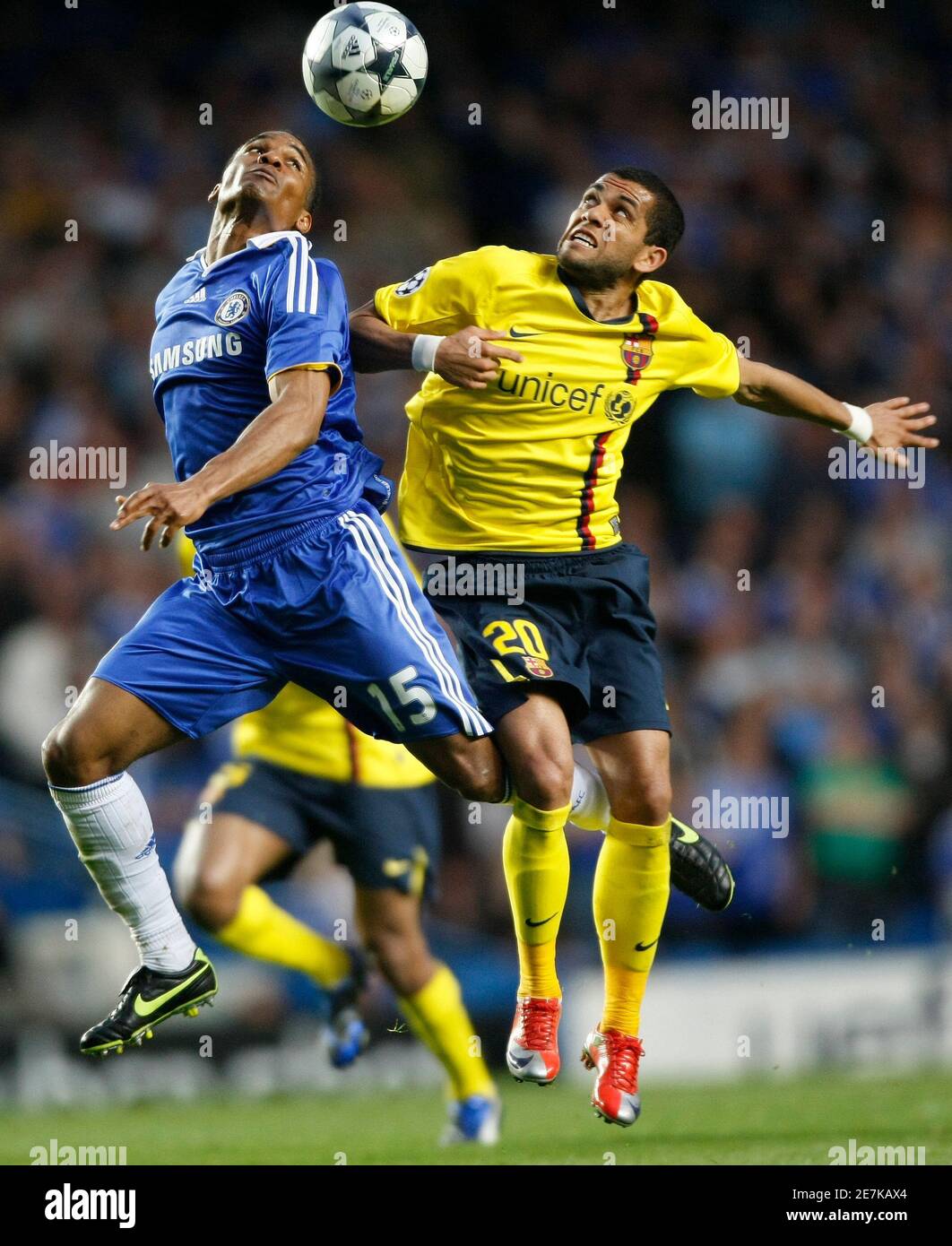 Florent Malouda L Of Chelsea And Daniel Alves Of Barcelona Jump For The Ball During Their Champions League Second Leg Semi Final Soccer Match At Stamford Bridge In London May 6 09 Reuters Albert