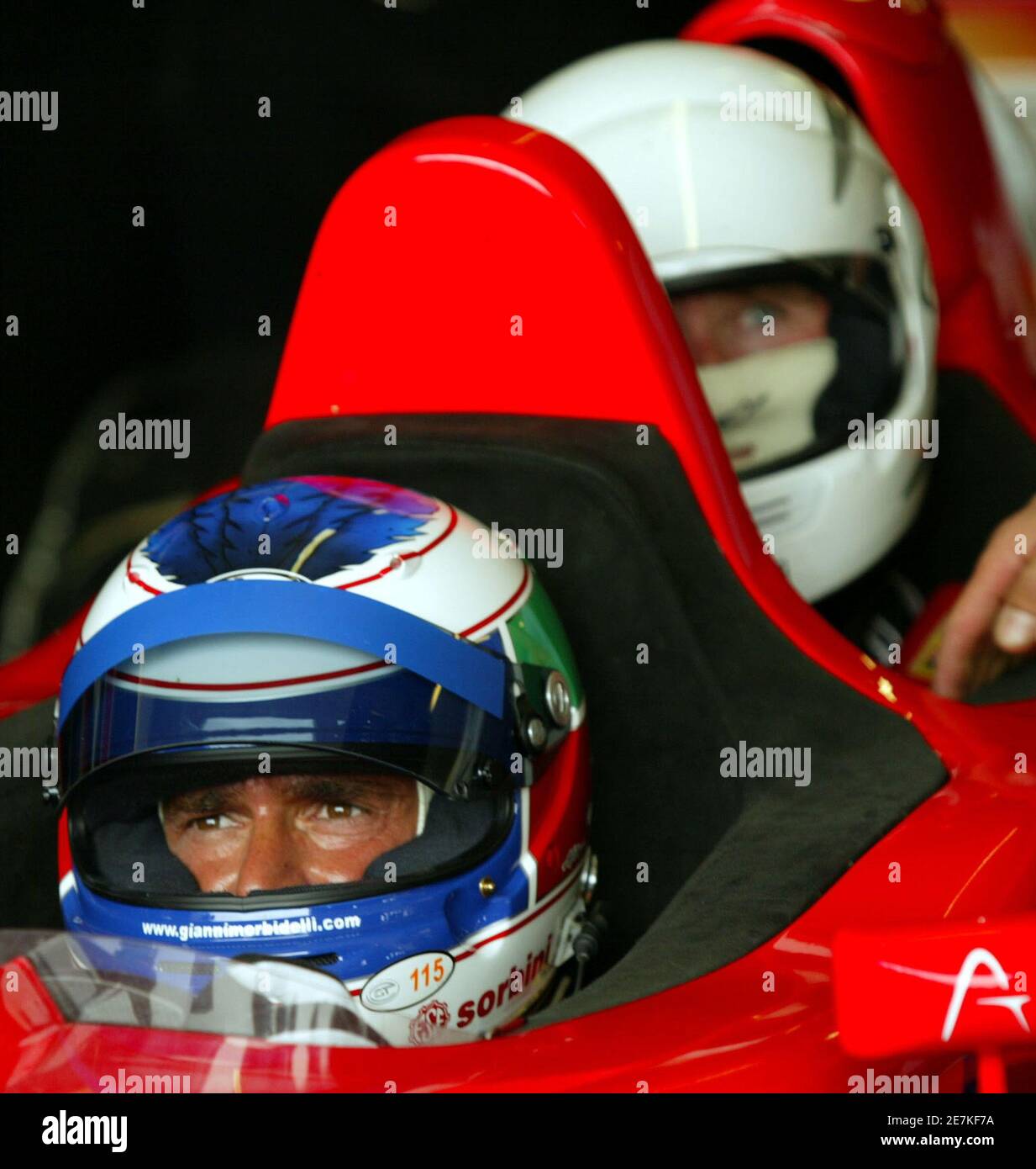 Italian driver Gianni Morbidelli sits in his F1x2 Grand Prix car with a passenger during a free practice session in Kyalami, north of Johannesburg, November 11,2005. The South African Grand Prix Master will take place on Sunday. REUTERS/Juda Ngwenya Stock Photo