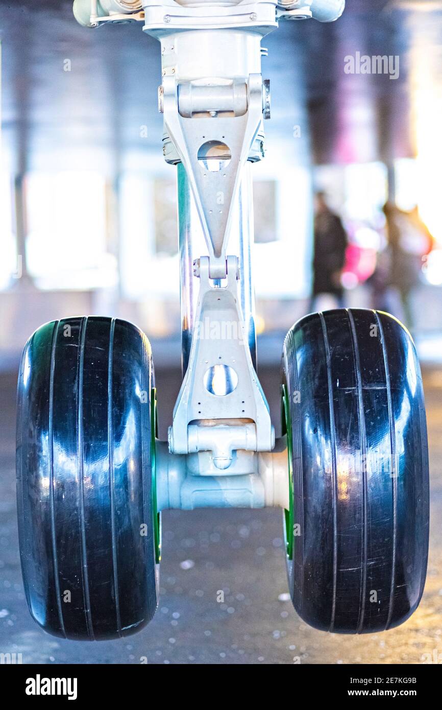 The forward landing gear of a passenger aircraft in the air when