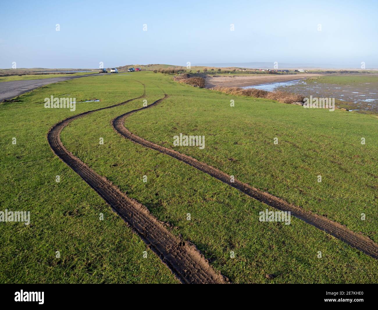 NORTHAM, NORTH DEVON, ENGLAND - JANUARY 29 2021: Car tyre tracks on the grass, mud at Northam Burrows coastal reserve. Stock Photo