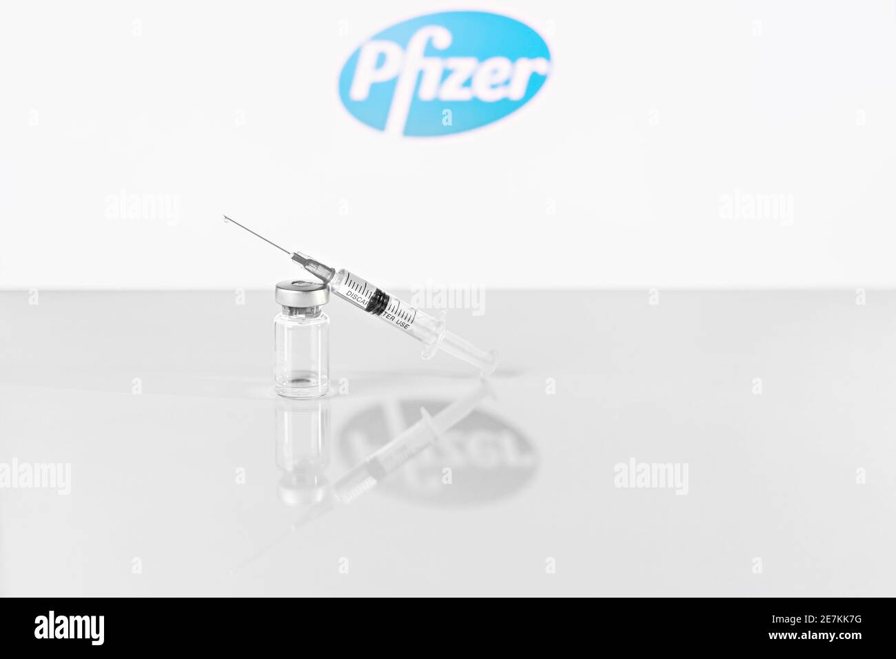 Syringe and vial with coronavirus vaccine, injection vial dose on a ...
