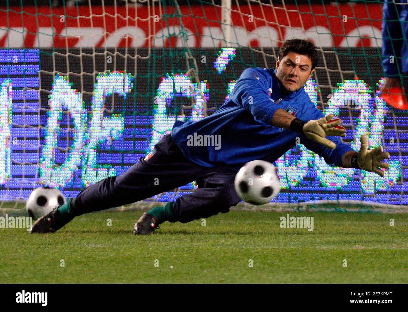 Italy's goalkeeper Marco Amelia dives for the ball before their  international friendly soccer match against Spain