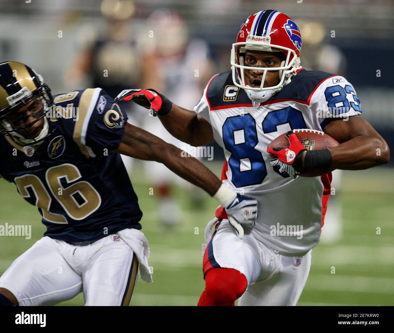 Buffalo Bills wide receiver Lee Evans (83) catches a 49-yard pass against  St. Louis Rams Tye Hill (26) during the first quarter of the their NFL  football game in St. Louis, Missouri