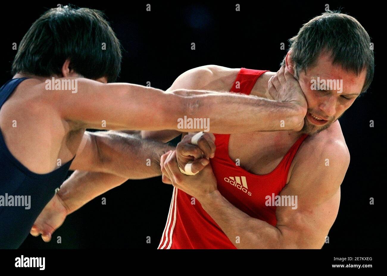 India's Ramesh Kumar (L) challenges Moldova's Alexandr Burca during their  bronze medal in the men's 74 kg free style at the World Wrestling  Championships 2009 in Herning September 23, 2009. REUTERS/Bob Strong (
