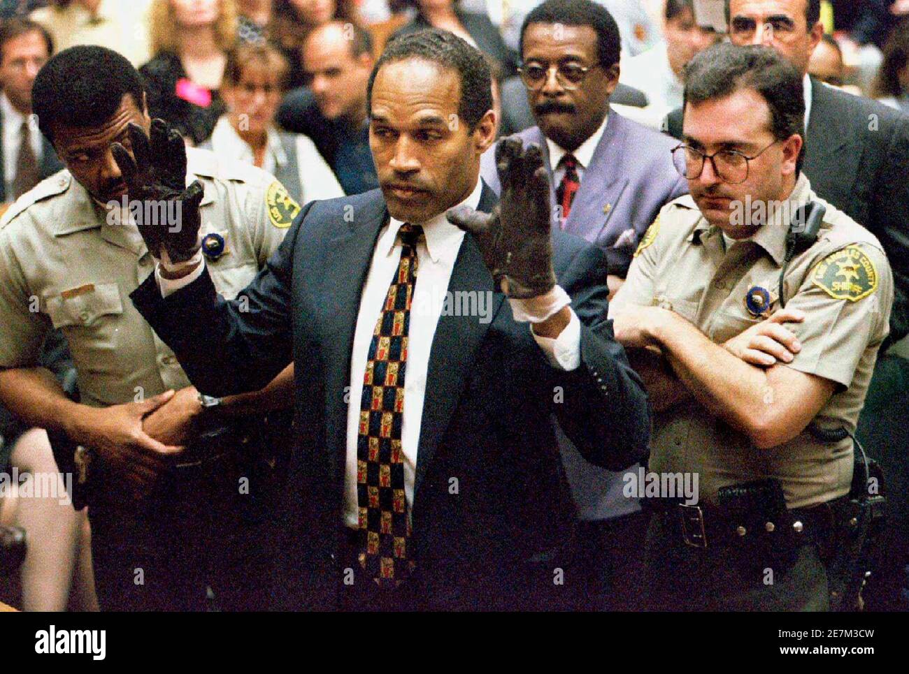 O.J. Simpson holds up his hands to the jury wearing the infamous gloves  found at the crime scene and his home in this June 15, 1995 file photo.  More than a decade