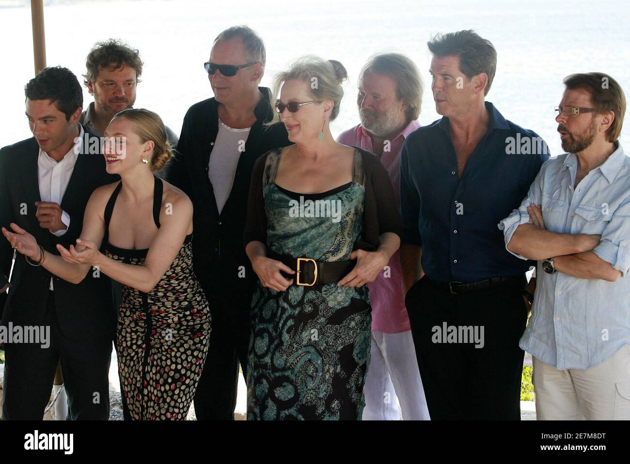 L-R) Dominic Cooper, Colin Firth, Amanda Seyfried, Stellan Skarsgard, Meryl  Streep, former ABBA member Benny Andersson, Pierce Brosnan and former ABBA  member Bjorn Ulvaeus pose during a photo opportunity at a promotional