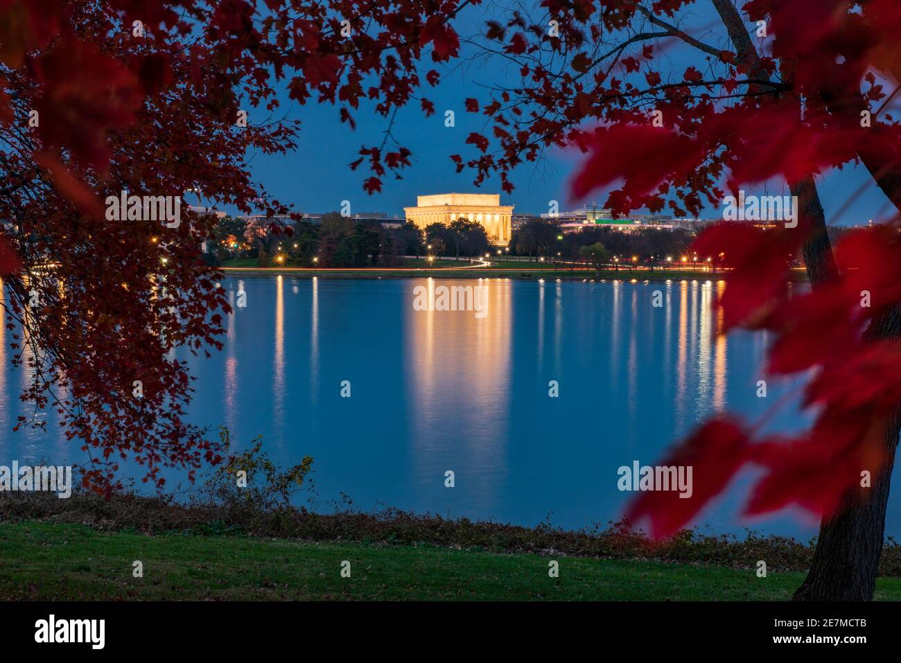 The glow of the Lincoln Memorial reflects on the Potomac River on an Autumn evening. Stock Photo